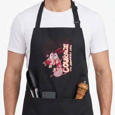 Running dog apron - Pink Courage the Cowardly Dog character running with outlined monsters and vertical stacked text — shown on a black cotton canvas apron against a white background