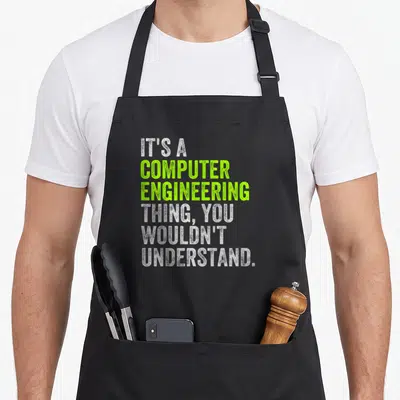 Computer engineering apron - Stacked white and lime green text reading IT'S A COMPUTER ENGINEERING THING YOU WOULDN'T — shown on a black cotton canvas apron against a white background