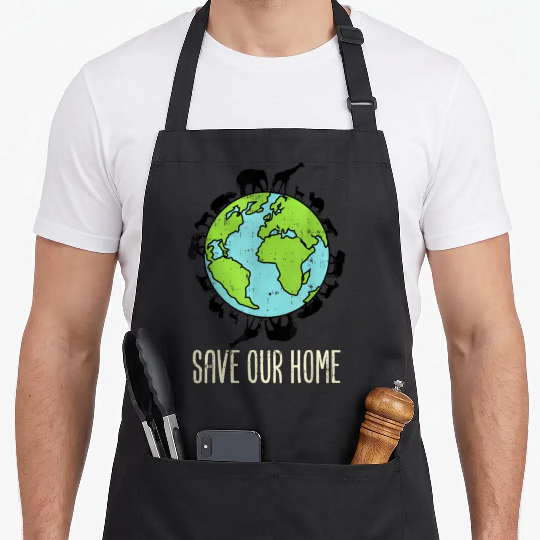 Our animal apron - SAVE OUR HOME text below Earth surrounded by black animal silhouettes in blue and green — shown on a black cotton canvas apron against a white background