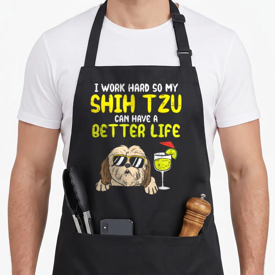 Hard shih dog apron - Cartoon shih tzu with sunglasses and cocktail below stacked text about better life — shown on a black cotton canvas apron against a white background