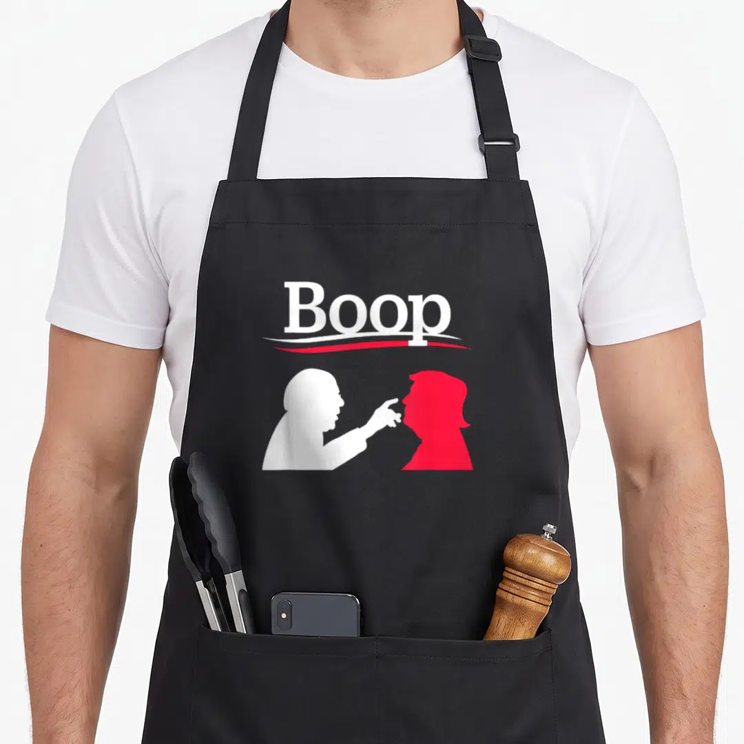 Boop us aprons - White and red silhouettes touching noses under the word Boop — shown on a black cotton canvas apron against a white background