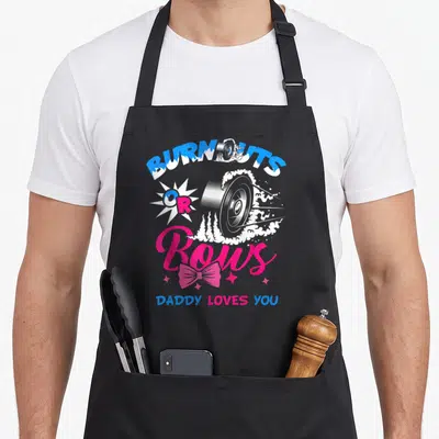 Baby bow apron - Car wheel smoke BURNOUTS OR Bows DADDY LOVES YOU cartoon print — shown on a black cotton canvas apron against a white background