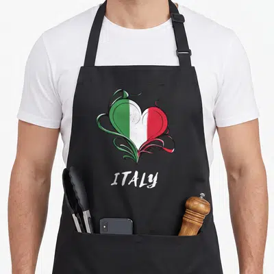 Flag italian aprons - Heart shape filled with Italian flag colors and ITALY text below — shown on a black cotton canvas apron against a white background