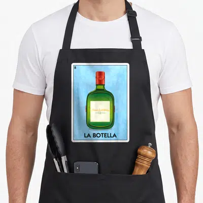 Botella mexican apron - Green bottle with red cap on blue background reading 8 Blended Scotch Whisky La Botella — shown on a black cotton canvas apron against a white background