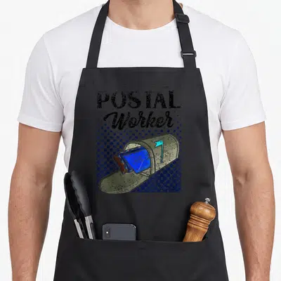 Mailman mail postman postal aprons - Retro mailbox with blue letters and black POSTAL Worker text on blue halftone — shown on a black cotton canvas apron against a white background