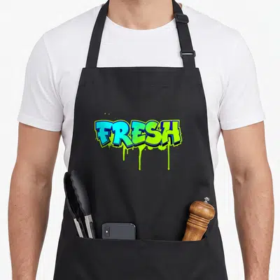 School fresh air apron - FRESH text in blue and lime green with dripping paint effect — shown on a black cotton canvas apron against a white background