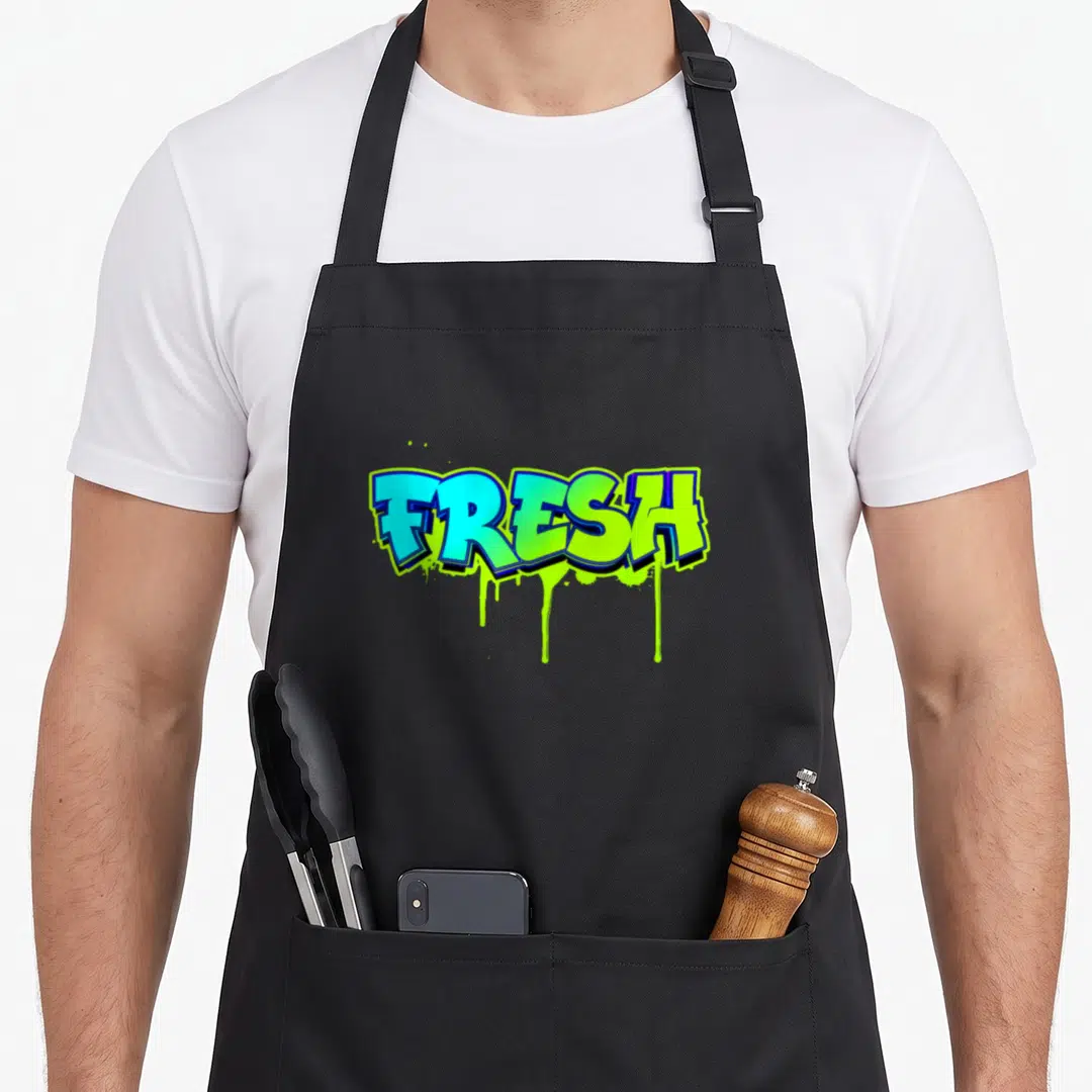 School fresh air apron - FRESH text in blue and lime green with dripping paint effect — shown on a black cotton canvas apron against a white background