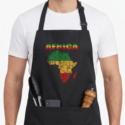 Continent african apron - Distressed map of Africa with AFRICA text in green yellow red stripes — shown on a black cotton canvas apron against a white background