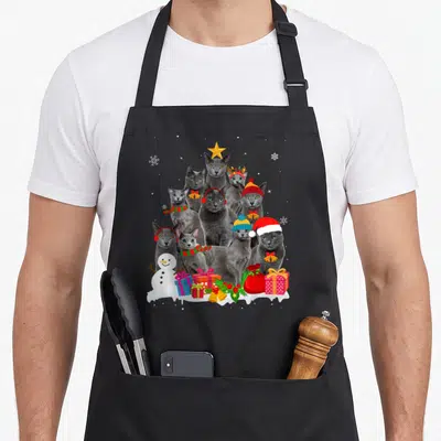Tree russian aprons - Nine grey cats in a pyramid shape with a snowman and Christmas gifts on white snow — shown on a black cotton canvas apron against a white background