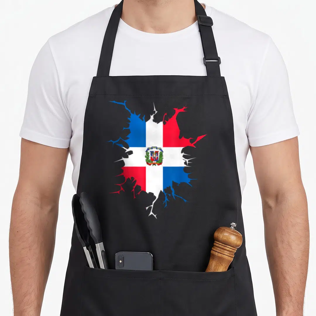Inside pride apron - Dominican Republic flag shaped like a cracked hole with a coat of arms in red, white, and blue — shown on a black cotton canvas apron against a white background