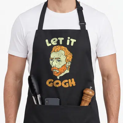 Gogh painter apron - Distressed portrait of Vincent van Gogh with orange hair and green skin under arched text — shown on a black cotton canvas apron against a white background