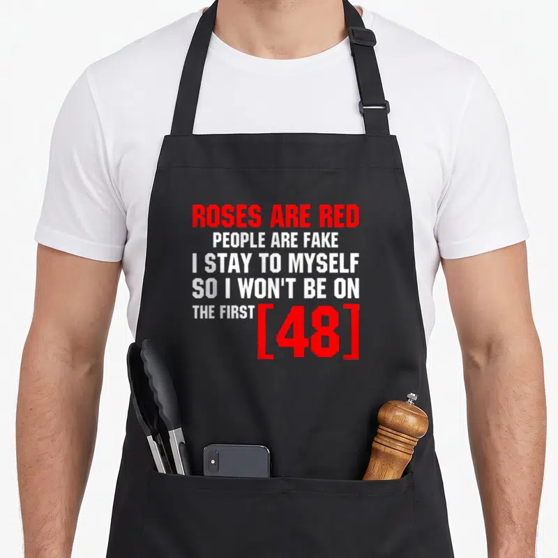 Fake rose apron - Red and white stacked text reading Roses Are Red People Are Fake I Stay To Myself The First 48 — shown on a black cotton canvas apron against a white background