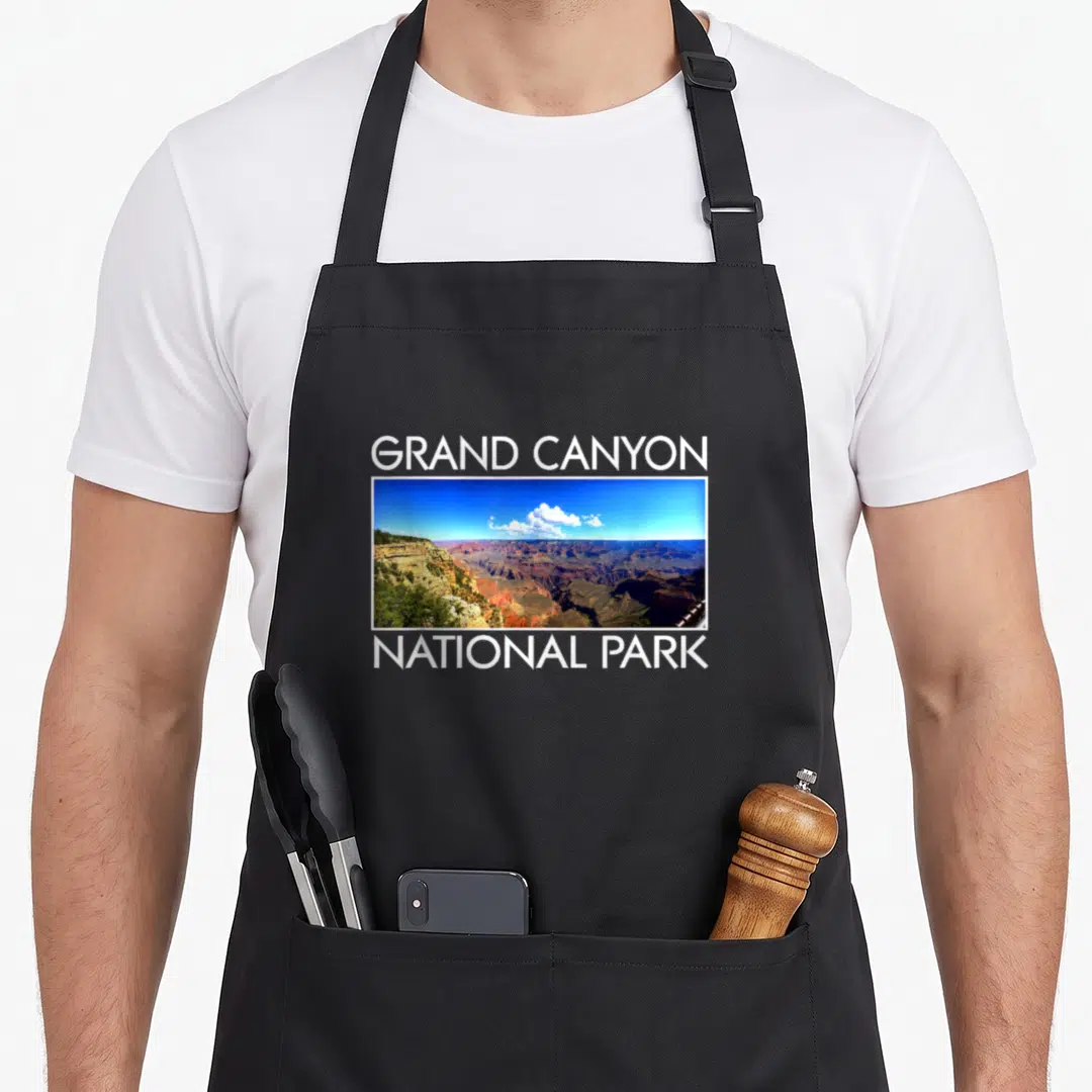 Grand canyon apron - Grand Canyon photo with white text and two front pockets — shown on a black cotton canvas apron against a white background