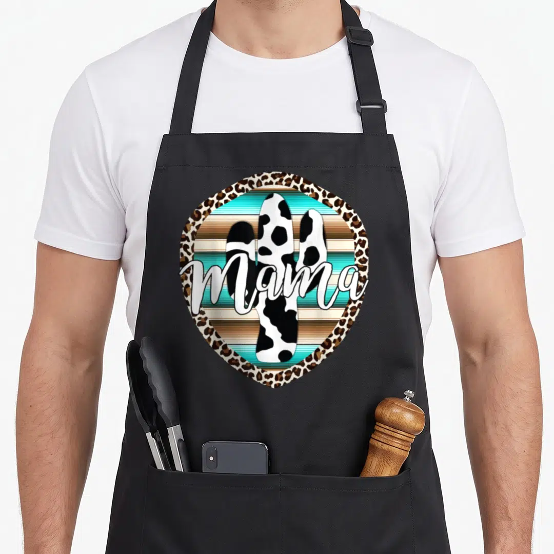 Western cow print apron - Spotted cactus with white mama script inside leopard border over teal stripes — shown on a black cotton canvas apron against a white background