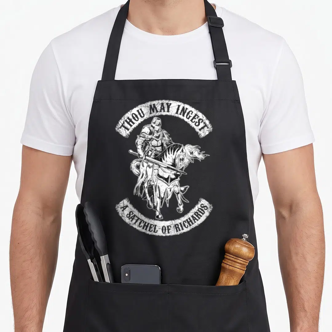 Eat bags and aprons - White distressed knight on horseback with arched text THOU MAY INGEST A SATCHEL OF RICHARDS — shown on a black cotton canvas apron against a white background