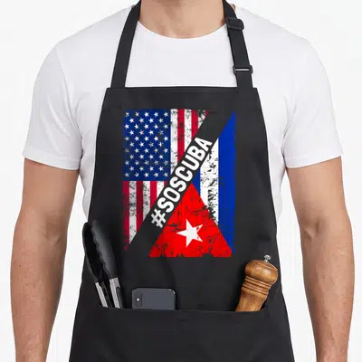 Sos american flag apron - Distressed USA and Cuba flags with grey #SOSCUBA diagonal band — shown on a black cotton canvas apron against a white background
