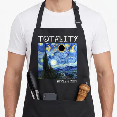 Solar eclipse totality april apron - Watercolor painting of solar eclipse sequence in Van Gogh style with text TOTALITY — shown on a black cotton canvas apron against a white background