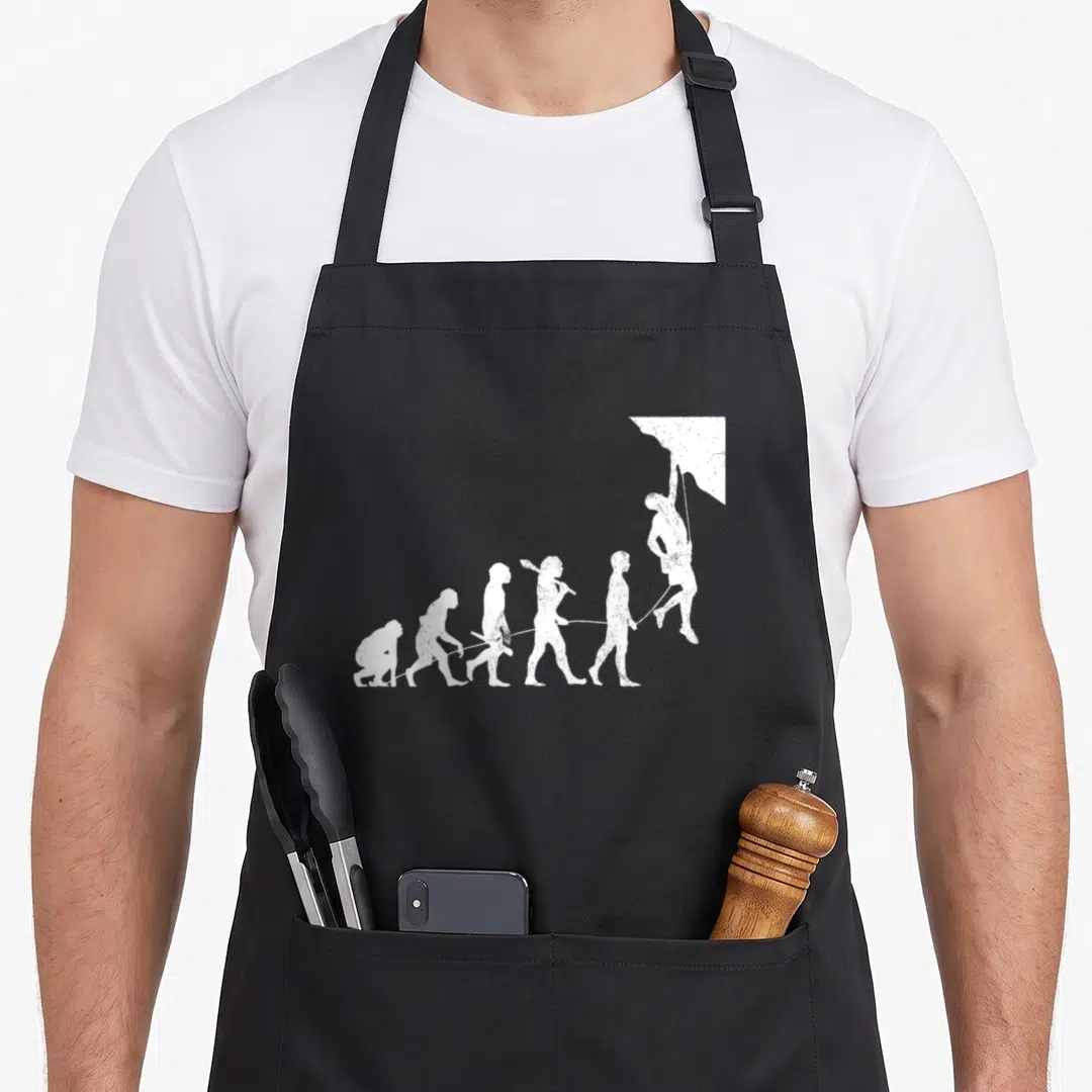 Solo bouldering apron - Distressed white evolution sequence ending in a hanging climber silhouette — shown on a black cotton canvas apron against a white background