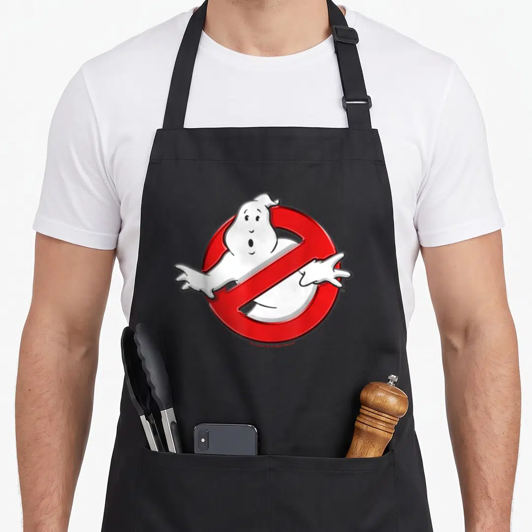 Movie fan lover apron - White cartoon ghost behind red prohibition circle on black bib — shown on a black cotton canvas apron against a white background