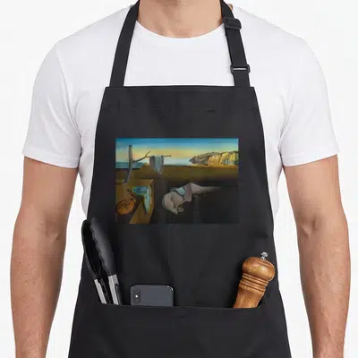 Persistence memory apron - Surreal melting clocks in blue and yellow on brown ground with ants on orange watch face — shown on a black cotton canvas apron against a white background