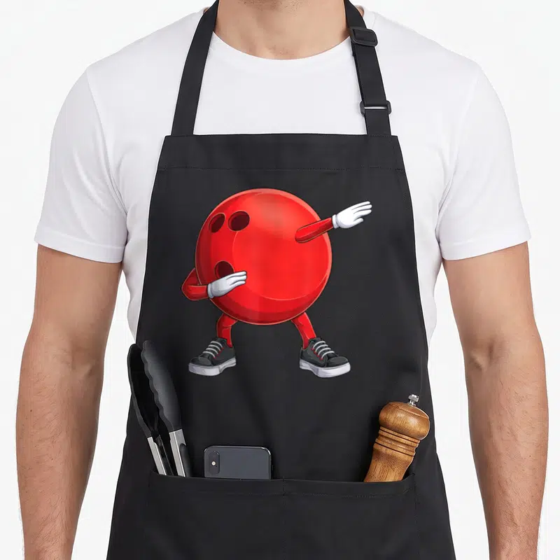 Dab bowling lover apron - Red bowling ball with arms legs white gloves and black sneakers in a cartoon dab pose — shown on a black cotton canvas apron against a white background