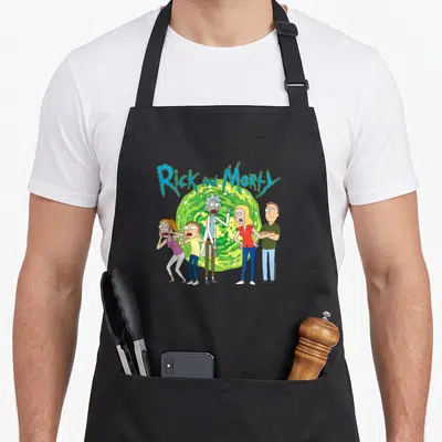 Portal personalized family aprons - Rick and Morty text above five cartoon characters standing before a green portal — shown on a black cotton canvas apron against a white background