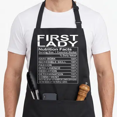 Appreciation church aprons - First Lady nutrition facts label with white text listing hard work and dedication — shown on a black cotton canvas apron against a white background