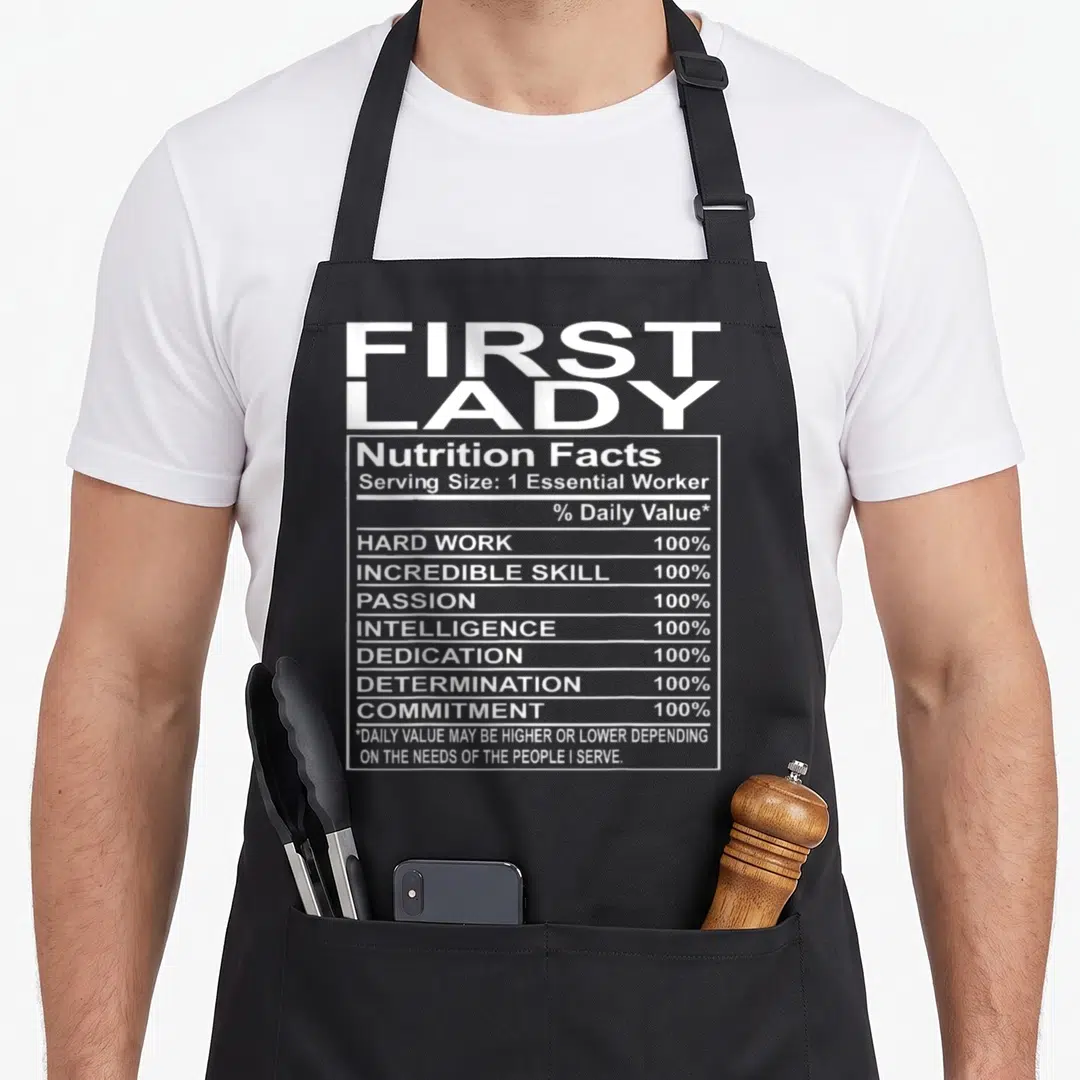 Appreciation church aprons - First Lady nutrition facts label with white text listing hard work and dedication — shown on a black cotton canvas apron against a white background
