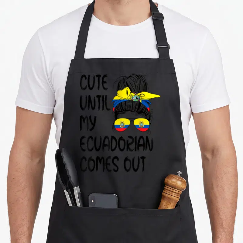 Come ecuadorian apron - Cute Until My Ecuadorian Comes Out text with woman wearing flag sunglasses and messy bun — shown on a black cotton canvas apron against a white background