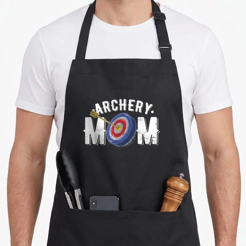 Arrow shooting bow apron - Distressed ARCHERY. MOM text with a target and arrow graphic in blue red and yellow — shown on a black cotton canvas apron against a white background