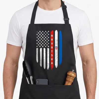Flag croatia croatian aprons - Distressed vertical US and Croatian flags with HRVATSKA text and coat of arms in red — shown on a black cotton canvas apron against a white background