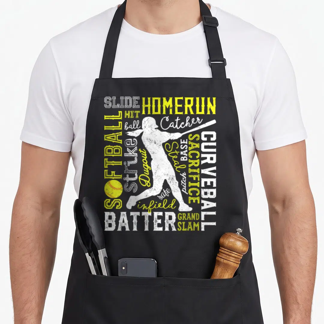 Softball pitcher apron - White and yellow softball words surrounding a batter silhouette with a yellow ball at bottom — shown on a black cotton canvas apron against a white background