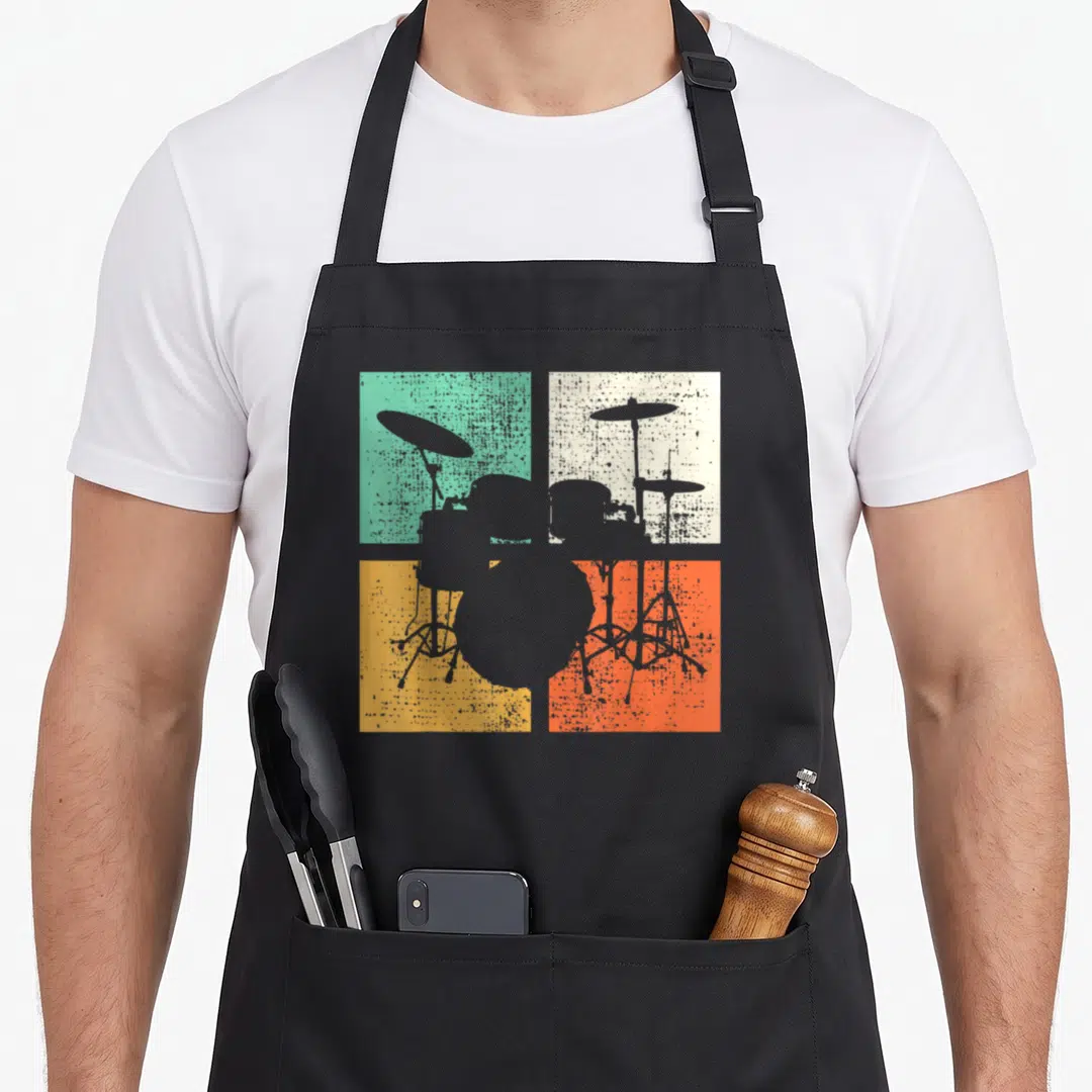 Drummer drum set apron - Grey drum kit silhouette over teal beige yellow and orange squares — shown on a black cotton canvas apron against a white background