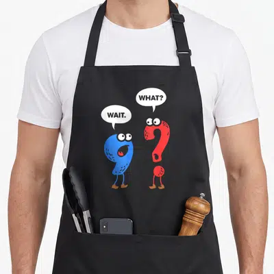 Grammar teacher apron - Blue comma and red question mark with eyes legs brown shoes white speech bubbles containing text — shown on a black cotton canvas apron against a white background