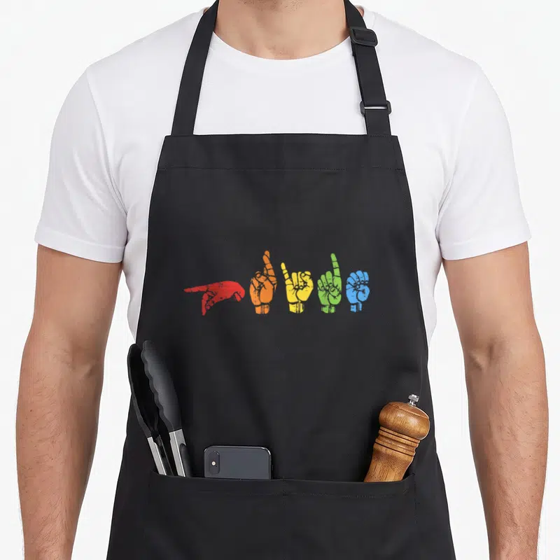 Rainbow asl sign for apron - Five rainbow hands in red orange yellow green blue making ASL signs for love — shown on a black cotton canvas apron against a white background