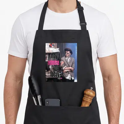 May pretty apron - Man in hat and glasses with text may I admire you today? and pretty in pink — shown on a black cotton canvas apron against a white background