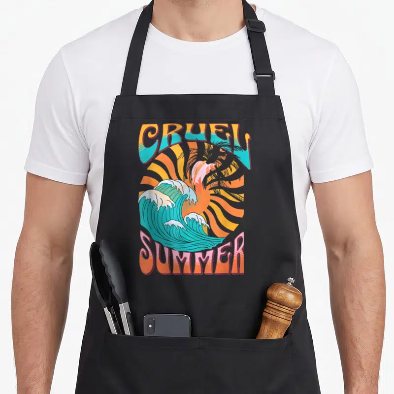 Cruel summer aprons - Retro wave and sun graphic with CRUEL SUMMER text in teal and orange — shown on a black cotton canvas apron against a white background