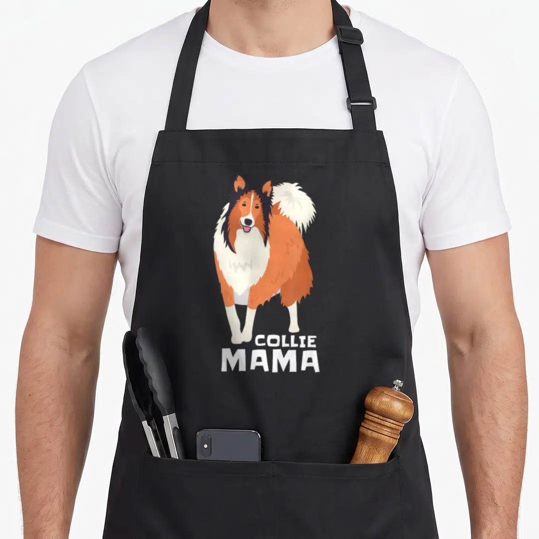 Collie mama dog apron - Cartoon Rough Collie standing above white text reading COLLIE MAMA on black fabric — shown on a black cotton canvas apron against a white background
