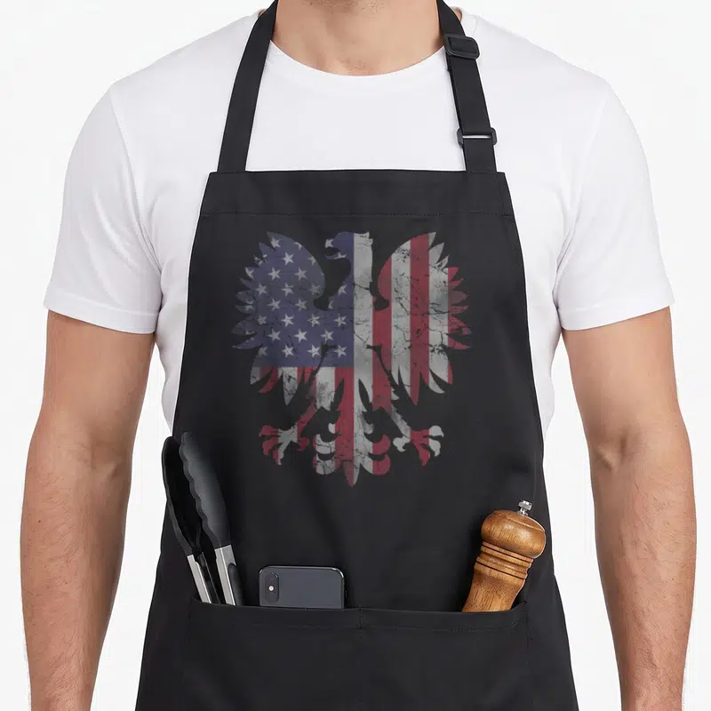Fade polish aprons - Distressed eagle silhouette filled with red white and blue USA flag pattern — shown on a black cotton canvas apron against a white background
