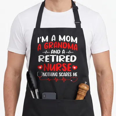 Grandma white nurse apron - Stacked text I'm a mom grandma retired nurse nothing scares me with stethoscope and heart — shown on a black cotton canvas apron against a white background