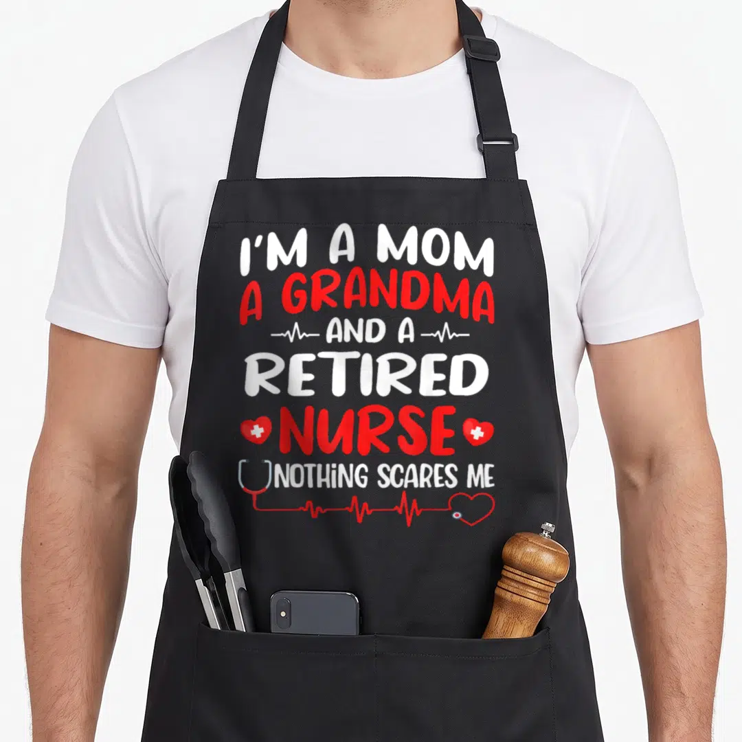 Grandma white nurse apron - Stacked text I'm a mom grandma retired nurse nothing scares me with stethoscope and heart — shown on a black cotton canvas apron against a white background