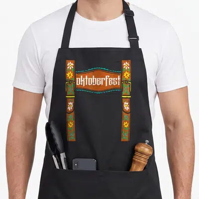 Costume oktoberfest lederhosen apron - Cartoon brown suspenders with flowers and buckles framing Oktoberfest text — shown on a black cotton canvas apron against a white background
