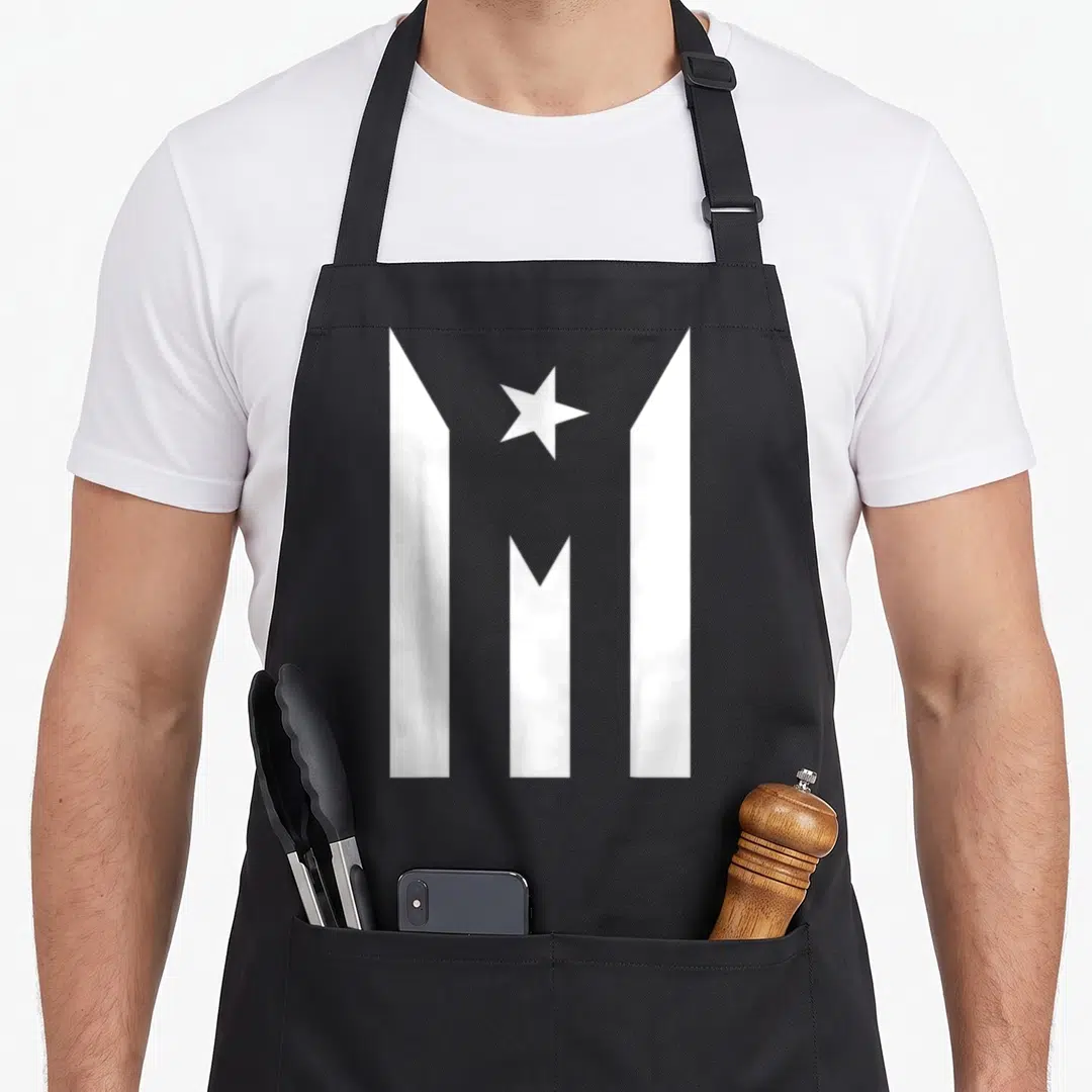 Rico rican apron - White star and vertical bars minimalist symbol on grey background — shown on a black cotton canvas apron against a white background