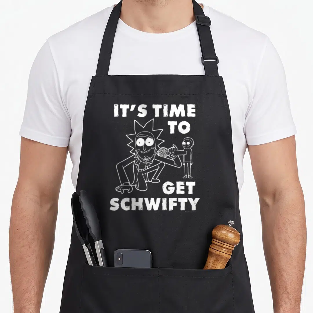 Schwifty dub apron - White line art of Rick and Morty with microphones and text IT'S TIME TO GET SCHWIFTY — shown on a black cotton canvas apron against a white background