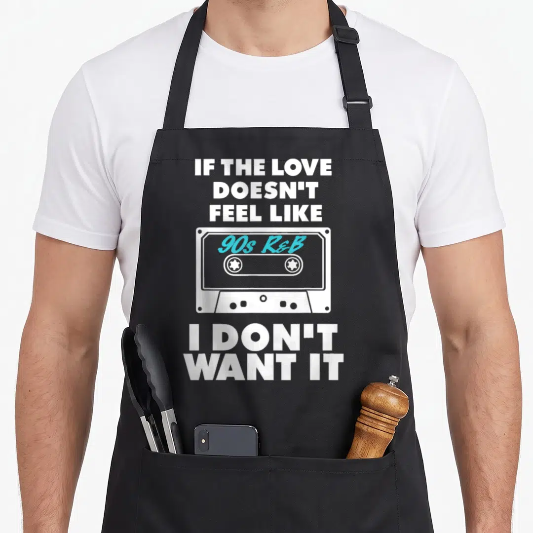 Funny feel r aprons - White cassette tape with cyan 90s R&B text and stacked white slogan lettering — shown on a black cotton canvas apron against a white background