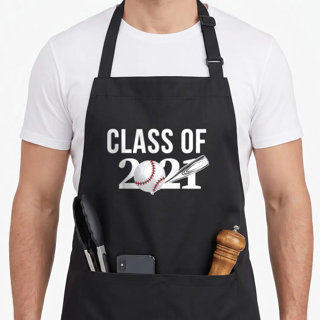 Class baseball apron - CLASS OF 2021 text with white baseball and bat featuring red stitching — shown on a black cotton canvas apron against a white background