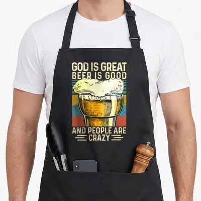 Vintage god beer apron - Retro beer glass with text God Is Great Beer Is Good And People Are Crazy on colored stripes — shown on a black cotton canvas apron against a white background