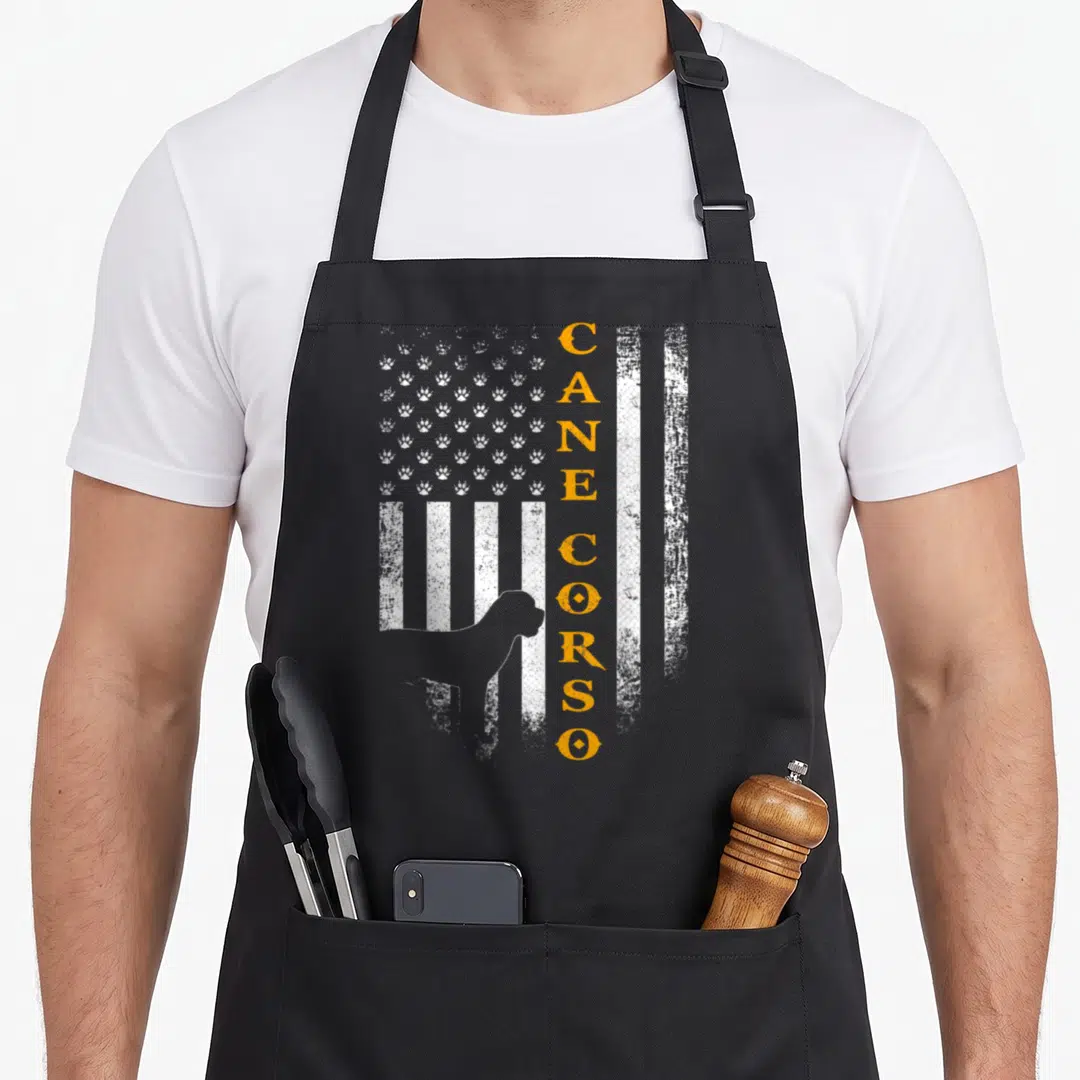 Dog cane apron - Distressed flag with paw prints, orange CANE CORSO text, and dog silhouette — shown on a black cotton canvas apron against a white background