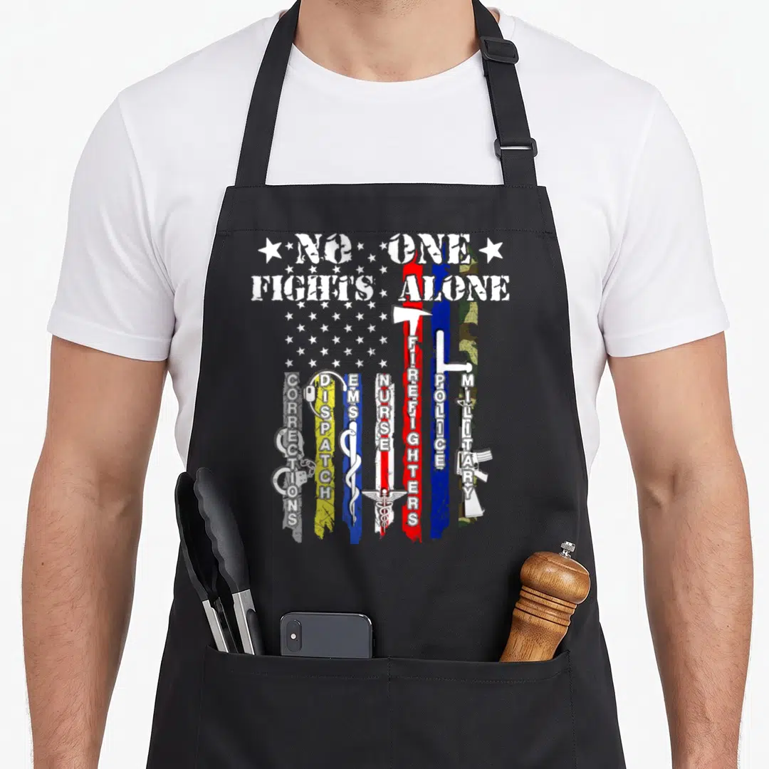 Fight police apron - NO ONE FIGHTS ALONE text above vertical colored stripes with symbols for police, fire — shown on a black cotton canvas apron against a white background
