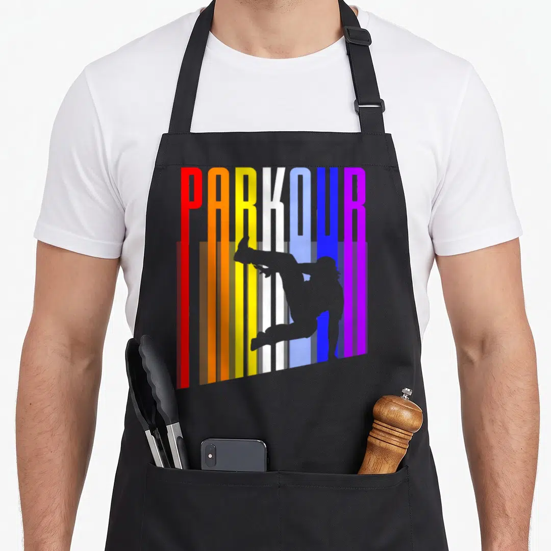 Parkour distressed apron - Grey jumping silhouette overlapping vertical red orange yellow white blue purple PARKOUR — shown on a black cotton canvas apron against a white background